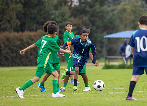Young players contesting the ball in an organized match